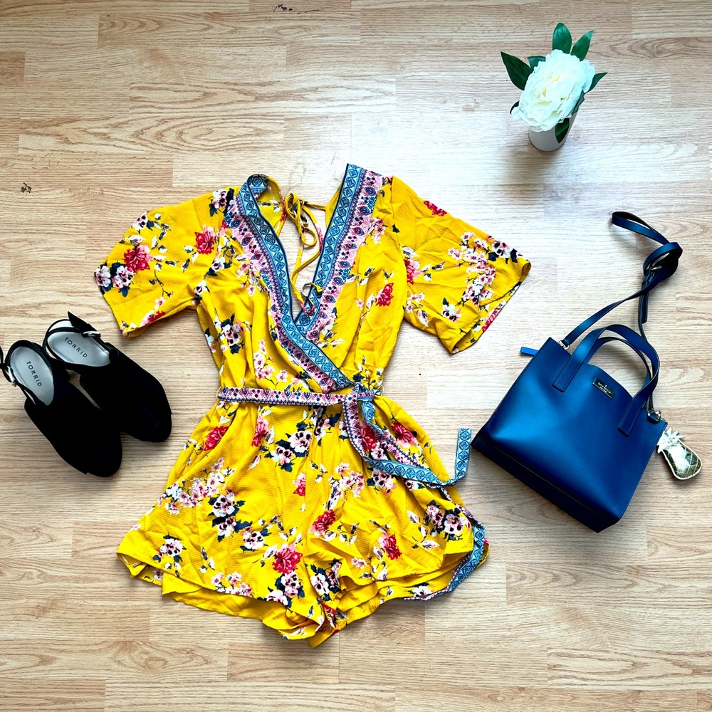 Flowy romper with tie for easy cinch at the waist. Loose shorts for comfort.